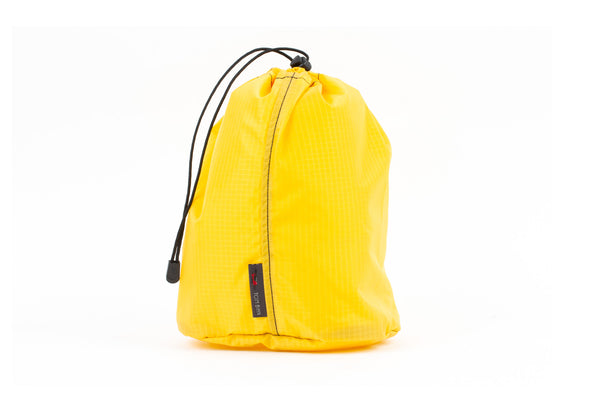 A Size 4 Marigold (yellow with light yellow grid) 210 Cerylon Travel Stuff Sack.